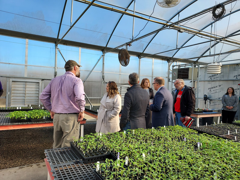Members of the Kansas City Ag Business Council and Rep. Davids staff tour the OHREC greenhouse.
